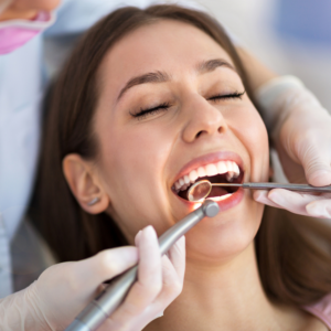 Woman having teeth examined